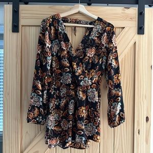 Floral dark grounded romper